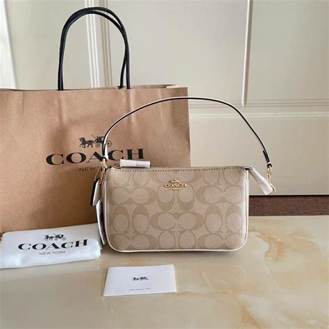 coach pouch original|coach official website uk.